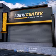 the front of a commercial building with an overhead roller up door that says lubri center