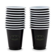 a stack of black and white cups with batman logos on them