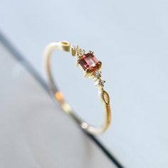 Holiday Notice: We will be on holiday from Feb 6 to Feb 15 for the Spring Festival. Orders will be shipped after we resume work.  Tiny Garnet Ring, Simple Garnet Promise Ring, Garnet Diamond Engagement Ring, Minial Garnet Ring, Thin Simple Promise Ring, Rings for WomenFeatures• Made to Order.• Material: 925 Silver with Gold Plated• Custom Gold Color: Yellow Gold• Main Stone: Natural Red Garnet & CZ• Ready to Ship in 7-15 Business Days Want to find out more? Check out my shop https://www.etsy Simple Rings With Stones, Diamond Topaz Ring, Marquis Engagement Rings, Simple Promise Ring, Promise Rings Simple, Sky Blue Topaz Ring, Slim Ring, Resume Work, Red Ring