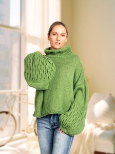 Hand - crafted from extra-fine merino wool, the eye-catching pullover ARLETH features exaggerated balloon sleeves that give this sweater a unique look and will pair perfectly with your favourite denim. DETAILS -Oversized, relaxed fit -Straight up neck -Extra-long puff sleeve Materials: 100% extra-fine merino wool Green colour. You can choose any other colour listed in the last photo. Care: we recommend dry cleaning for the best results.  Please keep your knitted piece folded and not on a hanger. Cozy Green Merino Wool Sweater, Green Merino Wool Knit Sweater, Merino Wool Long Sleeve Knitting Pattern, Long Sleeve Knitted Merino Wool Knitting Pattern, Merino Wool Turtleneck Knitting Pattern, Hand Knitted Merino Wool Turtleneck Pattern, Long Sleeve Knitting Pattern In Merino Wool, Hand Knitted Merino Wool Turtleneck Knitting Pattern, Winter Crop Top