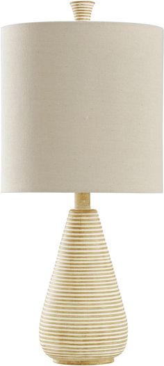 a white lamp with a beige shade on it