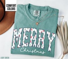 You will love this Merry Christmas shirt for women.  It says Merry in a beautiful Christmas tree font along with Christmas in a script font. This will be the perfect shirt for any woman to wear this holiday season.  Share your Christmas cheer with others this winter. Find our long sleeve tee and crewneck sweatshirts here: Short Sleeve Tee: https://etsy.me/4dGGUaR Long Sleeve Tee: https://etsy.me/3U0W2sW Crewneck Sweatshirt: https://etsy.me/4dxXqKl Comfort Colors T shirt Details: 100% ring-spun c Christmas Shirt For Women, Christmas Cricut Shirts, Winter T Shirt, Homemade Shirts, Christmas Shirts For Women, Diy Shirts, Winter T Shirts, Money Makers, Cute Christmas Shirts