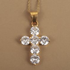 Christian cross pendant encrusted with rhinestones. Dimension of the pendant: 41 mm x 22 mm with the bail. Mounted on a 50 cm chain. Link width: 1.5 mm. In stainless steel gilded with fine gold. Stainless steel does not rust so this jewel is not afraid of water. Hypoallergenic. Comes with a gift bag. Gold Cubic Zirconia Pendant Cross Necklace, Gold Cubic Zirconia Cross Necklace, Christian Cross, Chain Link, Cross Pendant, Gift Bag, Jewelry Necklace Pendant, Handmade Items, Stainless Steel