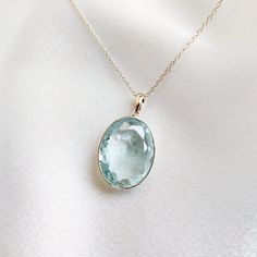 This stunning pendant is set in 14k Solid Yellow Gold with Natural Aquamarine with utmost precision. It is an unique gemstone Pendant for nearly every occasion and is completely hassle-free jewelry. ITEM DETAILS: * Gem: Aquamarine * Gem Size: 15X20mm * Gem Shape: Oval cut * Gem Weight: 12.17 carats * Gold Purity: 14KT * Gold Weight: 0.48 gram * Total Weight of the Pendant: 2.91 gram The Gold purity is guaranteed and it comes with authentic 14KT gold hallmark. Since my items are handmade, they are absolutely nickel and lead free. CUSTOMIZATION: * Gemstone customization is available and it can be substituted with a gem of your choice. Kindly message me for the same. PACKAGING * The Pendant comes with layers of safe and secure wrapping along with Free handmade jewelry box with every purchase. Sapphire Jewelry With Large Stone For Anniversary, Green Amethyst Birthstone Jewelry For Anniversary, Elegant Large Stone Necklace For Anniversary, Aquamarine Necklace For Anniversary, Anniversary Necklace With Large Round Stone Pendant, Anniversary Necklace With Large Round Pendant Stone, Anniversary Necklace With Large Round Pendant, Anniversary Round Pendant Necklace With Large Stone, Fine Jewelry Aquamarine Gemstones As Gift