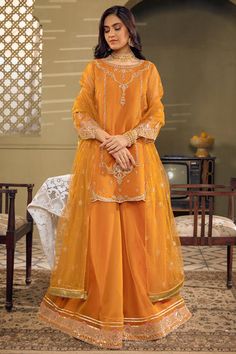 Mustard Orange Embroidered Pakistani Kameez Sharara Party Dress exemplifies exclusive cutwork, superior details on lustrous draperies for your approaching. Orange Pakistani Suit, Pakistani Kameez, Mustard Orange, Pakistani Suit, Pakistani Dresses Casual, Pakistani Fancy Dresses, Pakistani Fashion Party Wear, Beautiful Pakistani Dresses, Salwar Kamiz