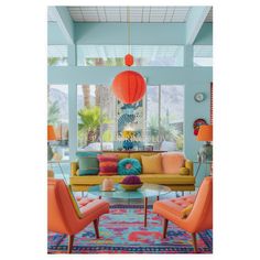 a living room filled with colorful furniture and decor