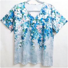 Nwot, This Colorful V-Neckline Tee Shirt Is Artfully Designed With Florals And Watercolor Brush Strokes. Made From Soft & Comfortable Fabric With A Slight Sheen. Its V-Neck Style And Short Sleeves Keep You Cool. Perfect For Vacation, Career Wear Or Everyday Comfort. New And Never Worn, In Excellent Condition. Please Check Your Measurements And Compare To These, Size Xl, 22" Across The Bust, 26.5" Long. - Colorful Floral Print - Soft And Comfortable - V-Neck Design - Lightweight Fabric - Wrinkle Watercolor Brush Strokes, Silk Tunic Top, Glitter Shorts, Black Long Sleeve Sweater, Artfully Designed, Watercolor Brush, Career Wear, Tie Dye Hoodie, Shoulder Shirts