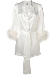 Ivory silk Mia satin robe from Gilda & Pearl featuring long sleeves, a loose fit, a tie waist and ostrich feather embellishments. POSITIVELY CONSCIOUS: Gilda & Pearl scores 3 out 5 by independent ethical brand rating agency Good On You. It has a good animal rating and does not use fur, leather, wool, down, exotic animal skin or angora. It traces most of its supply chain manufactures locally to reduce its carbon footprint. Nightwear Dress, Short Kimono, Silky Dress, Silk Robe, Ann Demeulemeester, Dolce E Gabbana, Luxury Lingerie, Versace Jeans, White Silk