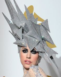 lady with silver hair and makeup at an awards event wearing a headpiece made out of diamonds