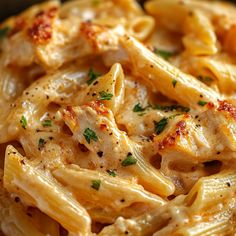 pasta with chicken and parmesan cheese in a bowl