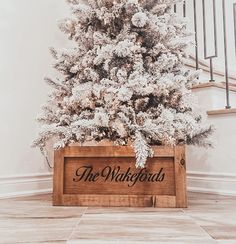 a white christmas tree in a wooden box with the words the walkouts on it