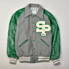 "Circa 1990s a letter jacket is a baseball-styled jacket traditionally worn by high school and college students in the united states to represent school and team pride as well as to display personal awards earned in athletics, academics or activities. letter jackets are also known as \"varsity jackets\" and \"baseball jackets\" in reference to their american origins. made in usa  good vintage conditions: some stains/signs of wear, common on these kind of vintage pieces. the skin on the sleeves feels slightly damp. size 38 pit to pit 54 cm pit to cuff 47 cm back length 70 cm" Collegiate Style Track Jacket For Fall Sports Events, Collegiate Track Jacket For Game Day, Collegiate Style Track Jacket For Game Day, Collegiate Outerwear With Letter Patch For College, School Varsity Jacket With Ribbed Cuffs, Team-colored Track Jacket For College And Winter, College Style Varsity Jacket With Baseball Collar, Retro Long Sleeve Varsity Jacket For Sports, Collegiate Style Track Jacket For Sports Season