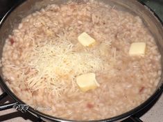 a pot filled with some kind of food on top of a stove next to a burner