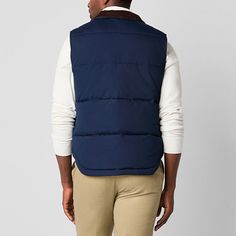 Layer up in style for cold-weather outings with this St. John's Bay men's quilted cargo puffer vest. Made from a warm material and lining, this midweight style has two front snap pockets and a full zip closure. Wear it over a sweater with jeans.Closure Type: ZipperPockets: 2 Front Snap PocketsWarmth Factor: MidweightApparel Length: 27 InchesOuterwear Length: ShortFiber Content: 100% PolyesterFabric Description: WovenFilling Content: 100% PolyesterLining: LinedLining Material: PolyesterCare: Mac… Quilted Vest For Cold Weather, Navy Utility Outerwear For Winter, Quilted Down Sleeveless Outerwear, Cotton Vest Outerwear For Cold Weather, Winter Utility Nylon Vest, Casual Vest With Padded Collar For Cold Weather, Casual Navy Vest With Pockets, Navy Sleeveless Outerwear With Pockets, Navy Down Puffer Outerwear