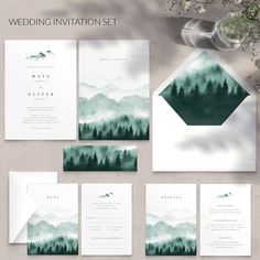 wedding stationery set with mountains and trees