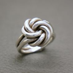 This lovely vintage ring is crafted from 835 silver and features a double knot design. The perfect symbol of eternal friendship, this ring is a wonderful way to show someone you care.  With its antique silver finish and mid-century design, this ring is sure to become a cherished addition to any jewelry collection. The "Tied Together Forever" sentiment adds a heartfelt touch, making it a meaningful gift for a friend or loved one. The ring will be shipped in a gift box.   Ring size: diameter 17.3 Adjustable Handmade Modernist Rings, Modernist Adjustable Handmade Rings, Modernist Silver Jewelry For Gift, Adjustable Modernist Sterling Silver Jewelry, Modernist Adjustable Silver Rings, Vintage Sterling Silver Jewelry, Friendship Symbols, Double Knot, Box Ring