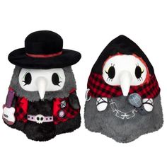 two stuffed animals wearing hats and scarves