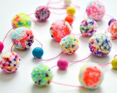 there are many different colored balls with sprinkles on them