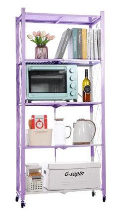 a purple shelf filled with lots of books and other items next to a microwave on top of a toaster oven