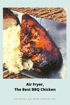 the cover of an air fryer cookbook shows chicken and rice on a plate