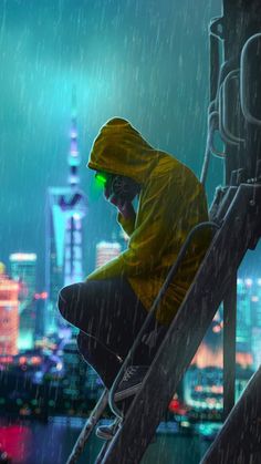 a man sitting on top of a metal rail in the rain wearing a yellow jacket