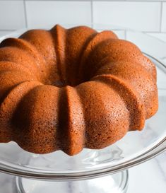 a bundt cake sitting on top of a glass plate