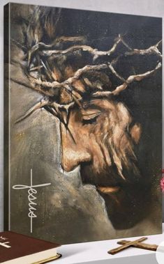 a painting of jesus's face with the crown of thorns on his head