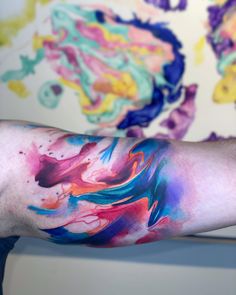 the arm is covered with colorful ink