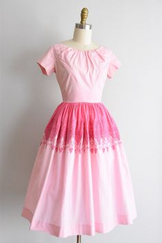 "Vintage 1950s cotton dress. Two tone pink with grape and vine embroidery near waistline. Capped sleeves, scoop collar, and piped waistband. Full skirt. Back metal zipper closure. State of garment | ok, some light color transfer near waist, refer to photos. one tiny spot on shoulder and skirt. one super faint yellow spot on skirt. being sold as is. Measurements ✂--- best fit | Extra Small / Small bust | 34\" shoulders | 14.5 shoulder to waist | 14.5\" sleeves | 5\" waist | 25\" hips | free total 1950s Style Pink Tea-length Dress, 1950s Pink Vintage Dress With Short Sleeves, 1950s Style Pink Daywear Dresses, 1950s Style Pink Vintage Dress, 1950s Style Pink Dress For Vintage Fashion, Pink 1950s Vintage Style Dress, Pink 1950s Vintage Dress, Pink 1950s Vintage Fashion Dress, Pink Retro Cotton Vintage Dress