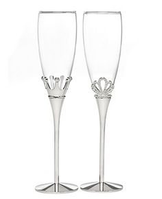 two wine glasses with crowns on them sitting next to each other in front of a white background