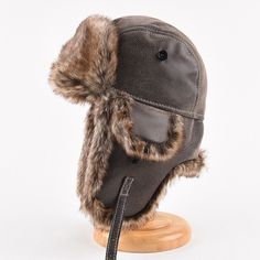 Leather Windproof Hats For Outdoor Use, Winter Windproof Leather Hat, Brown Aviator Winter Hats, Winter Brown Aviator Hats, Leather Winter Hat With Short Brim, Winter Leather Windproof Hat, Brown Leather Hats With Faux Fur Lining, Brown Winter Hats, Black Hats With Plush Lining And Ear Flaps