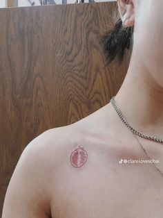 a woman with a small tattoo on her chest