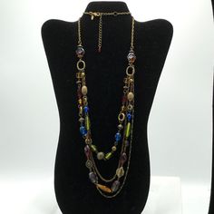 Brass tone with multicolored glass beads necklace by Lia Sophia. Multicolor Beaded Metal Necklaces, Elegant Multicolor Chain Necklace With Colorful Beads, Elegant Chain Necklace With Colorful Beads, Elegant Multicolor Beaded Chain Necklace, Multicolor Metal Necklace With Beaded Chain, Multicolor Metal Round Bead Necklaces, Multicolor Metal Necklaces With Round Beads, Multicolor Round Beads Metal Necklace, Multicolor Czech Glass Costume Jewelry Necklace