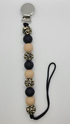 an animal print and black beaded necklace