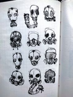 an open book with drawings of different types of gas masks on the front and back pages