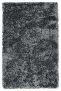 an area rug made out of shaggy grey carpet