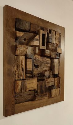 a piece of wood that has been made into a wall hanging on the side of a wall