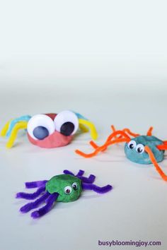 three plastic crabs with googly eyes on them