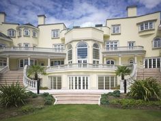 a large white building with many windows and balconies