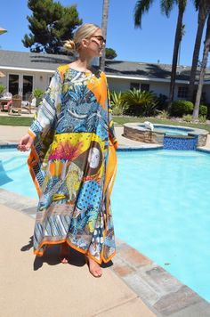 Absolutely stunning designer print, silk caftan, with it's breathtaking art print, would be a very special addition to your wardrobe. This luxurious, silk caftan is the height of glamour for beach, pool, that special vacation or just looking fantastic lounging or entertaining. One size. Fits many sizes, small to X-large. The width, edge to edge, is 54 inches or 108 inches around the body. The length is 52 inches. The side seams are 7 inches from the edge and can be adjusted if needed. The neckli Silk Cover Up, Multicolor Abstract Print Kaftan For Vacation, Vacation Kaftan With Multicolor Abstract Print, Vacation Multicolor Abstract Print Kaftan, Bohemian Silk Kaftan With Abstract Print, Multicolor Abstract Print Kaftan For The Beach, Silk Kaftan With Multicolor Vibrant Print, Multicolor Abstract Print Kaftan For Beach, Silk Maxi Dress With Vibrant Print For Beach