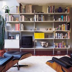 the living room is clean and ready to be used as an office or study area