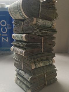 stacks of money are stacked on top of each other