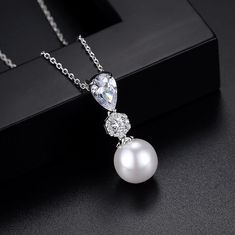 Romantic and elegant, this glowing pearl necklace and earrings set can complete the most sophisticated of bridal looks. A solitaire glass pearl (10mm) and cubic zirconia adorn the pendant that is hanging from a delicate chain for a very glamorous look. Overall length of the necklace is 18" (approx. 46cm). Closure is a lobster claw clasp with a 2" extension chain for comfortable sizing. The earrings are a replica of the pendant (10mm pearls) and come with sturdy backs. Overall length of the earri Bridal Jewellery Set, Pearl Drop Pendant, Beautiful Bridal Jewelry, Pearl Drop Necklace, Pearl Necklace Wedding, Wedding Pendant, Pearl Jewelry Wedding, Romantic Jewellery, Bridal Earrings Pearl