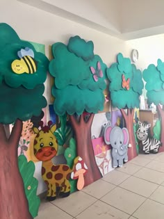 the wall is decorated with many different animals and trees