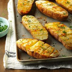 baked potatoes on a baking sheet with parsley