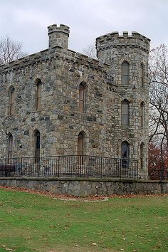 an old stone building with two towers on top