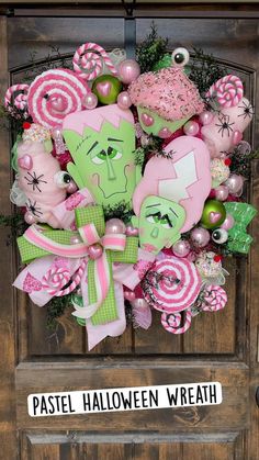 a wreath that is on the front door with candy and candies in pink, green and white