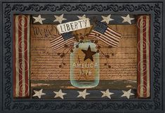 an american flag in a mason jar with the word liberty written on it and stars