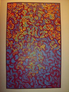 a red and blue painting hanging on the wall