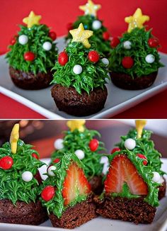 some cupcakes decorated like christmas trees on a plate with strawberries in the middle